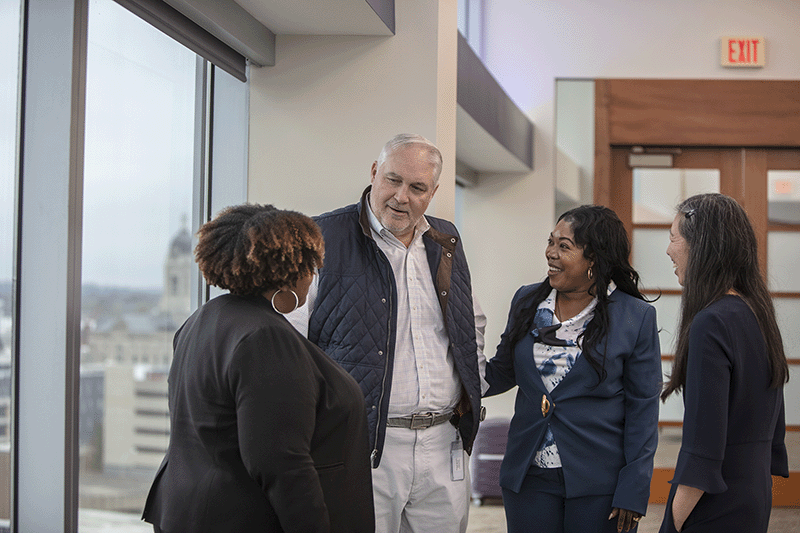 a picture of Jim Ryan speaking with members of the bank's CEO Council