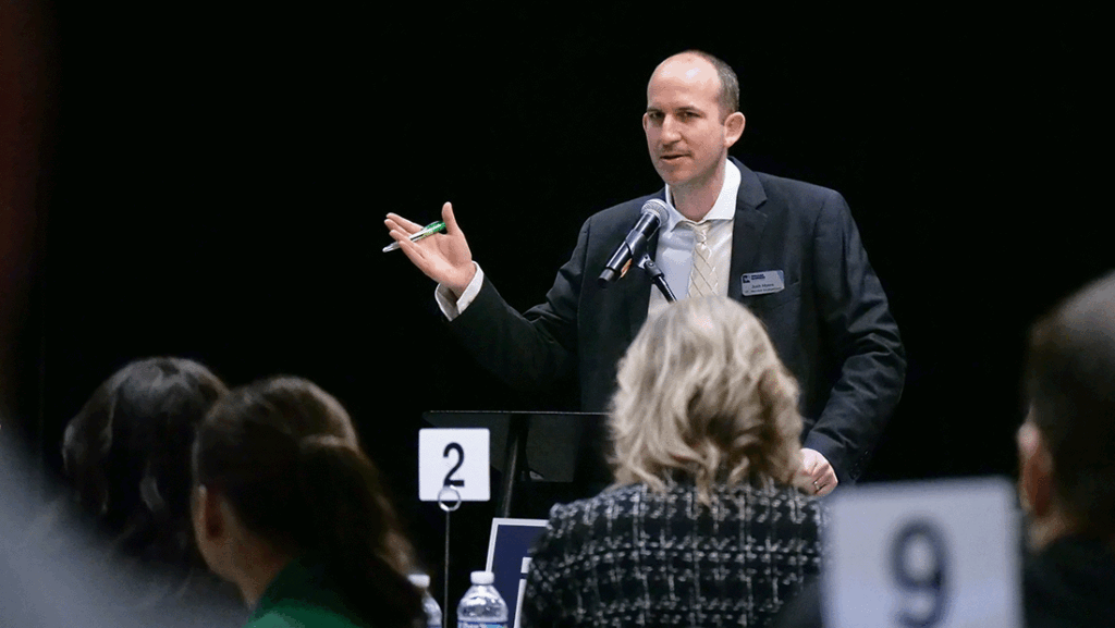 a photo of Josh Myers speaking to the Future Leadership Division