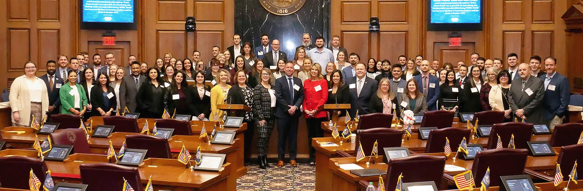 FLD members pose for a photo alongside lawmakers inside the House chamber