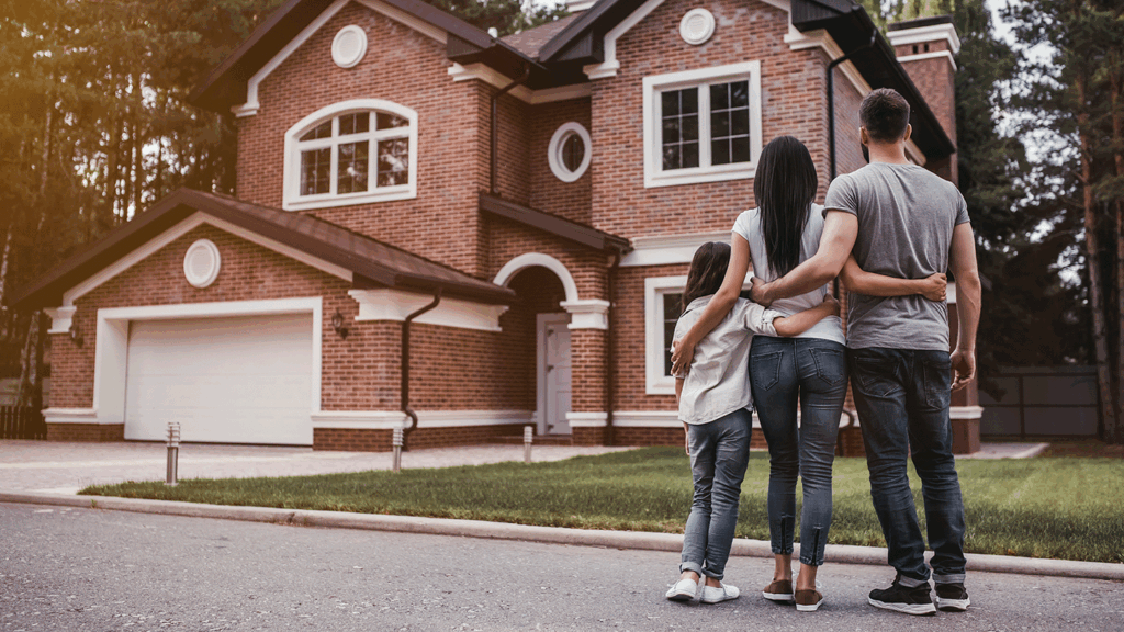 a picture of a family looking at a house