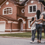 a picture of a family looking at a house