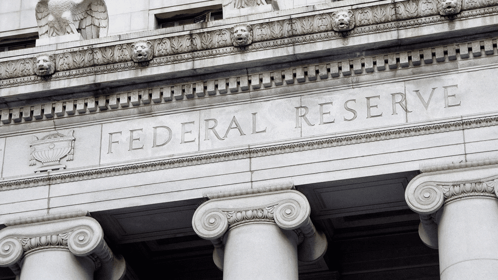 a photo showing the Federal Reserve's name engraved on the front of its headquarters in Washington, D.C.